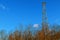 Image of communication mobile internet antenna over blue sky background