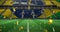 Image of confetti falling over brazilian flag in empty sports stadium