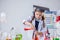 Image of cute chemist pours reagent into flask