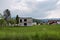 Image of devastated unfinished house structure in rural village area