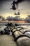 Image of drain pipe on the coast. waves and dramatic cloud during the sunset sunrise.