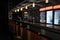 Image of an empty bar in a nightclub, with martini glasses and a menu