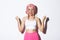 Image of excited successful girl in pink wig, celebrating something, making fist pump and smiling satisfied, enjoying