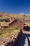 Image of facade of an ancien straw hatched  church mud walls  . Taken during springtime at Socaire at Los Flamencos national