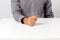 Image of fist on a white table
