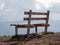 Image with focus of bench with mountains in the background