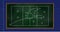 Image of football game strategy drawn on green chalkboard against blue lined paper background