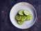 An image of fresh green cucumber slices on a plate