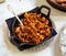 Image of fry pan with fried beef with chorizo on table