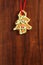 Image of gingerbread Christmas tree cookie over brown wooden tex