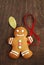 Image of Gingerbread man on brown cutting board