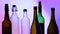 Image of glasses, bottles and alcohol on a luminous background.