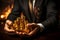 Image Gold bullion in businessmans hands, symbolizing success against stock charts