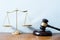 Image of Golden scales of justice and gavel for lawyer courtroom on the desk