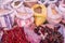 Image of grains in sacks and red dry chili peppers and pasilla chili in a mexican market