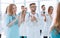 image of a group of doctors walking in a hospital corridor .