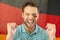 Image of happy caucasian man with flags of germany on face over flag of germany