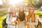 Image of happy friends muslim sisters women walking outdoors holding books