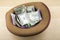 Image of hat money wooden desk