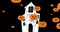 Image of haunted house over falling pumpkins on dark background