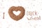 Image of a heart from buckwheat on a white background. favorite buckwheat. cereal in the form of a heart. top view of