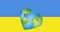 Image of hearts and heart shaped earth over flag of ukraine