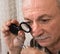 Image of jeweler examining jewel