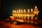 Image of jewish holiday Hanukkah background with crystal menorah traditional candelabra and oil candles