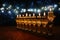 Image of jewish holiday Hanukkah background with crystal menorah traditional candelabra and oil candles