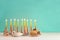Image of jewish holiday Hanukkah with creative menorah traditional Candelabra, donut and wooden dreidel spinning top