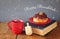 image of jewish holiday Hanukkah with donuts, wooden spinning top, cup of hot chocolate and old book.