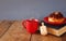 image of jewish holiday Hanukkah with donuts, wooden spinning top, cup of hot chocolate and old book.