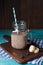 Image of jug with milkshake with straw