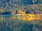 Image of kayaker on a peaceful mountain lake in autumn