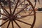An image of a large old-fashioned wooden bicycle wheel