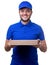 Image of man in blue T-shirt and baseball cap with cardboard box for pizza