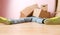 Image of man in jeans lying under cardboard boxes