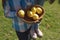 Image of midsection of african american girl holding bowl with lemons