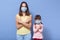 Image of mother and small girl with pigtails wearing medical protective masks against viral diseases during coronavirus epidemic,