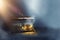 Image of mysterious magical treasure chest with light over wooden old table and dark background