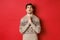 Image of nervous and hopeful man praying to God, begging for help with christmas, wearing winter sweater, looking up and