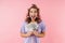 Image of nice delighted woman looking at camera and holding dollars