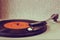 Image of old record player, image is retro filtered . selective focus