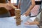 Image of old woman and two girls hand holding blocks wood game to growing up of home business, Risk of management and strategy