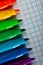 Image of opened multicolored markers on notepad