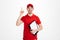 Image of optimistic delivery man in red t-shirt and cap smiling