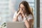 Image of pensive businesswoman seating in office