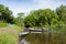 Image in Peruvian jungle of a boat in a river in Amazon forest. Traditional way of transportation in tropical rivers