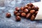 Image of a pile of chestnuts on stone texture floor