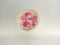 Image of pink-flower beads on white bowl for handmade crafting